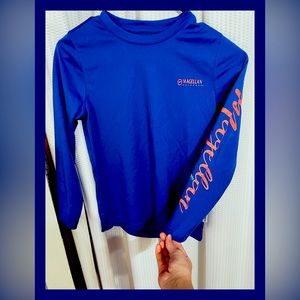 This is a blue kids MAGELLAN shirt.This material is also known for fishing gear.